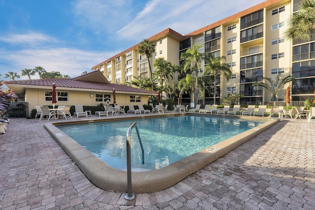 view of swimming pool featuring a patio area