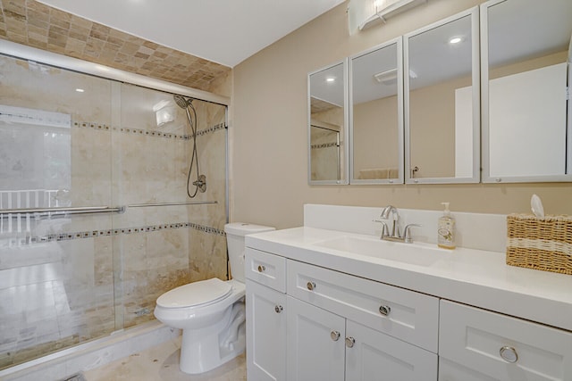 bathroom with vanity, toilet, and walk in shower