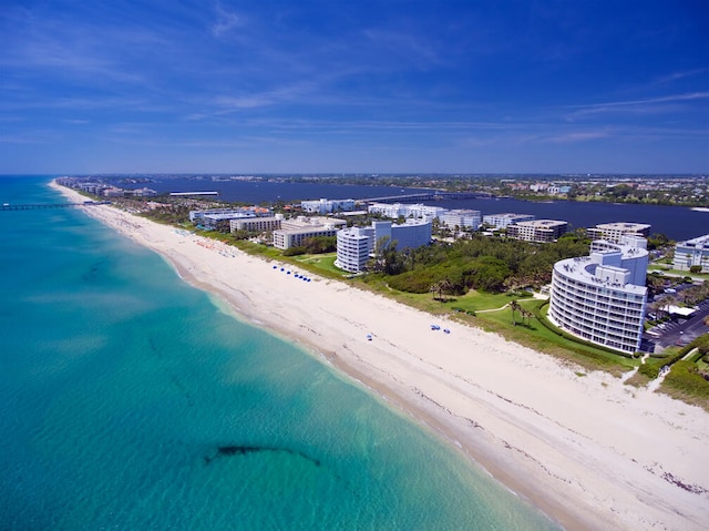 birds eye view of property featuring a water view and a view of the beach