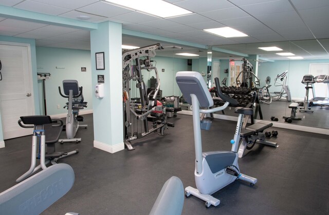 exercise room with a paneled ceiling