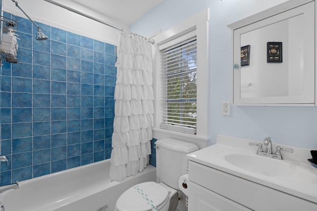 full bathroom with shower / bath combination with curtain, vanity, and toilet