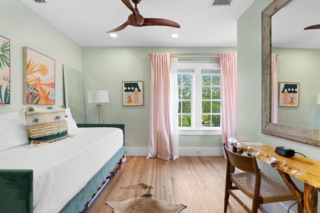 bedroom featuring ceiling fan and light hardwood / wood-style floors