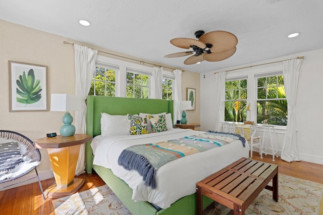 bedroom featuring wood-type flooring and ceiling fan