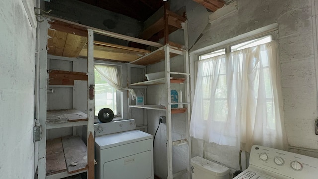 clothes washing area featuring washer / dryer