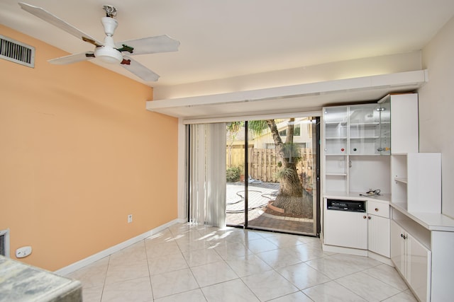 interior space featuring ceiling fan and light tile patterned floors