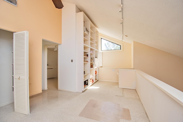 corridor featuring a textured ceiling