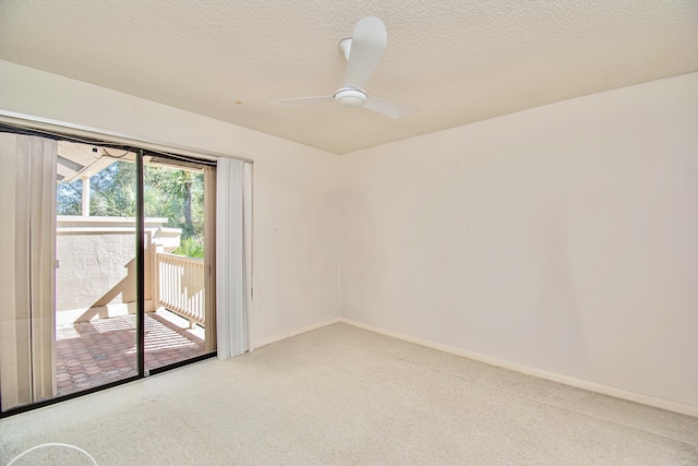 carpeted empty room with a textured ceiling and ceiling fan