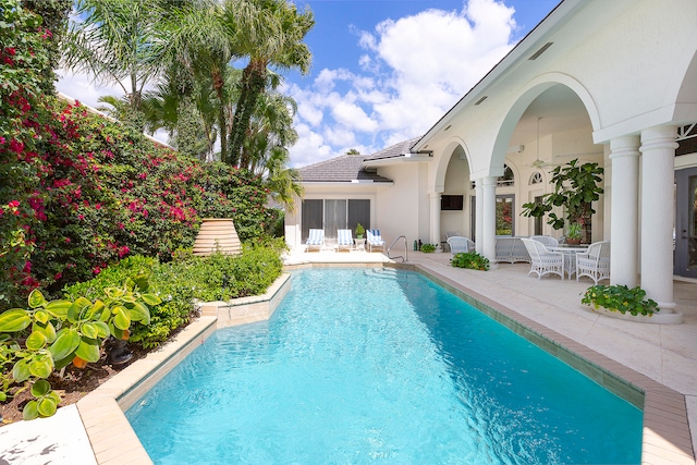 view of swimming pool featuring a patio area