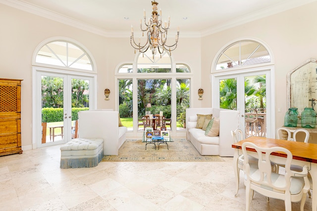 sunroom / solarium featuring french doors