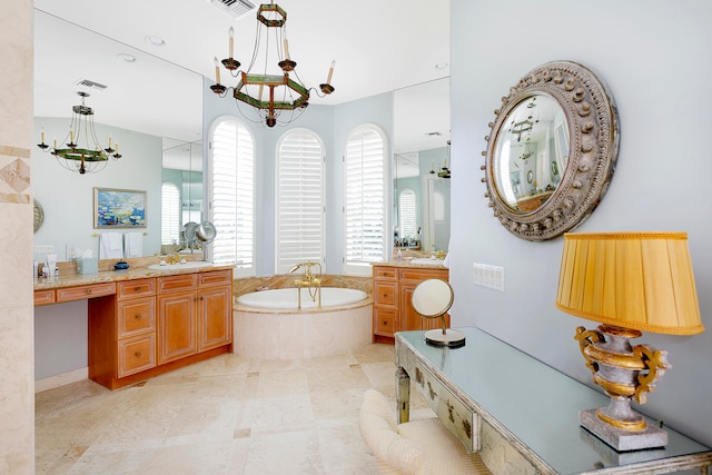 bathroom featuring vanity, a relaxing tiled tub, and a notable chandelier