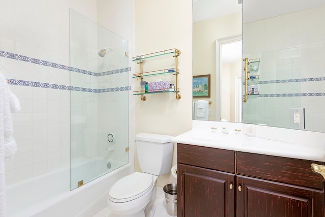 full bathroom with tile patterned flooring, vanity, toilet, and tiled shower / bath