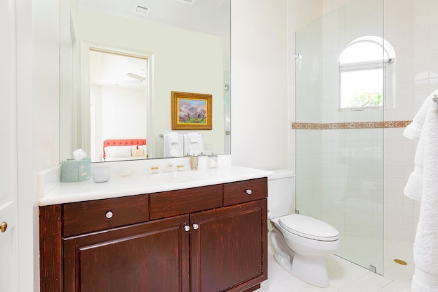 bathroom featuring ceiling fan, tile patterned flooring, toilet, a shower with door, and vanity