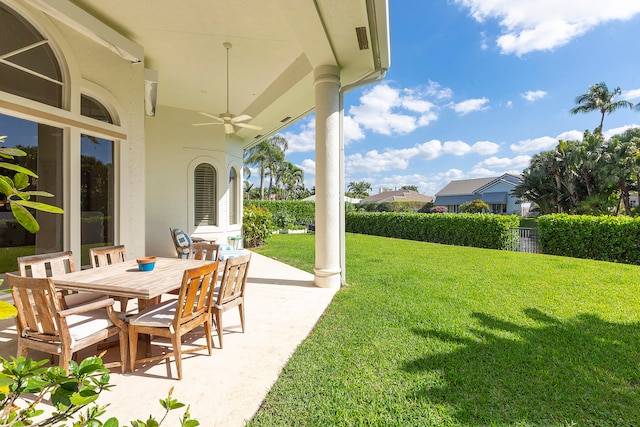 view of patio featuring ceiling fan