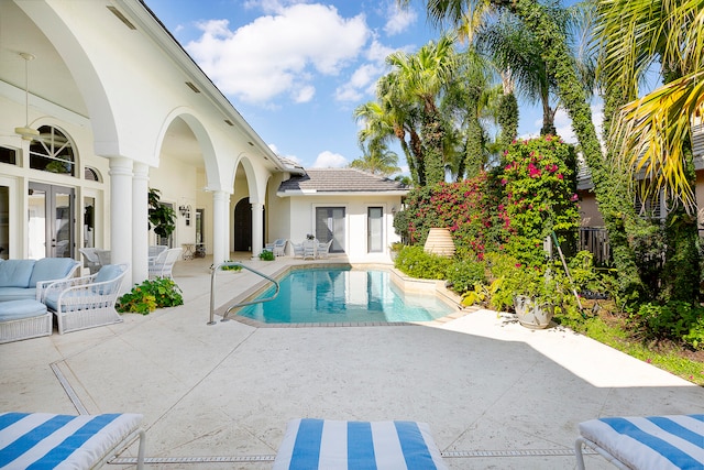 view of pool with outdoor lounge area and a patio area