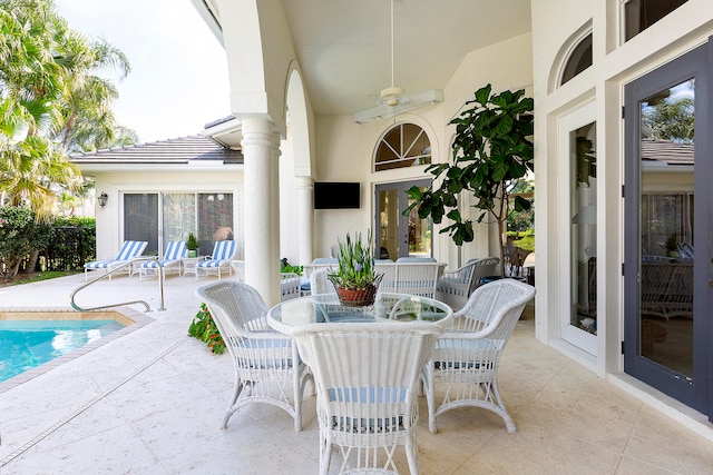 view of patio / terrace featuring ceiling fan and french doors