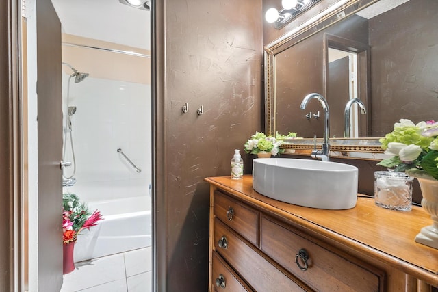 bathroom featuring vanity and  shower combination