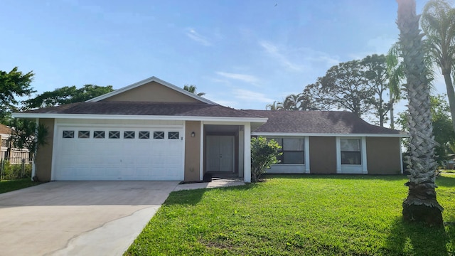 single story home featuring a front lawn and a garage