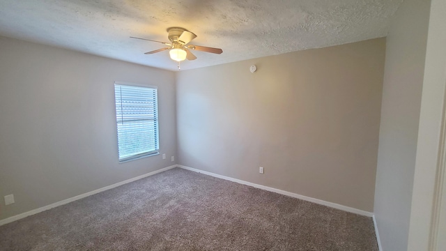 carpeted spare room featuring a textured ceiling