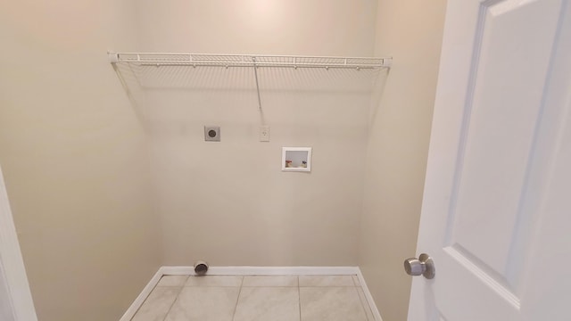 laundry area featuring electric dryer hookup, tile patterned flooring, and washer hookup