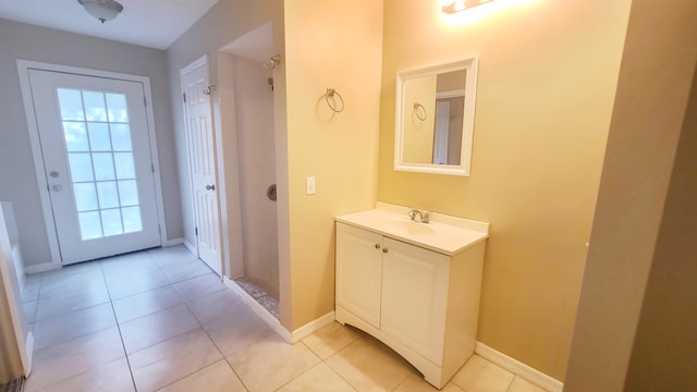 bathroom with tile patterned flooring and vanity