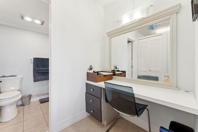 bathroom featuring tile patterned flooring, vanity, and toilet