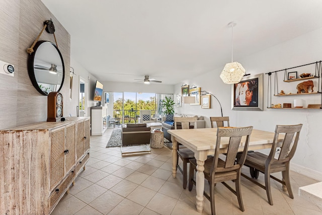 dining space with ceiling fan and light tile patterned floors