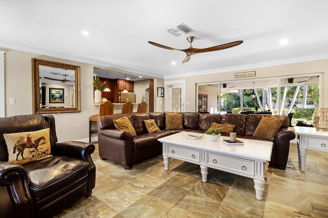 living room featuring ceiling fan and ornamental molding