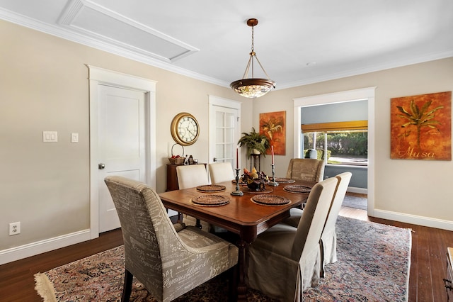 dining area featuring crown molding and dark wood-type flooring