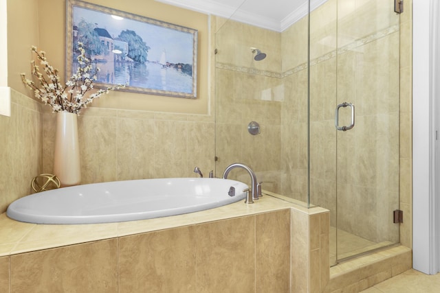 bathroom featuring separate shower and tub and crown molding