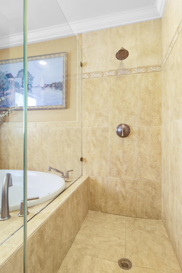 bathroom with tile patterned flooring, shower with separate bathtub, and crown molding