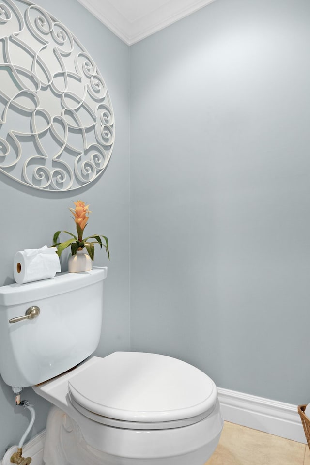 bathroom featuring toilet and ornamental molding