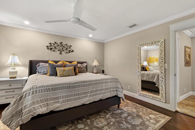 bedroom featuring ceiling fan, ornamental molding, and dark wood-type flooring