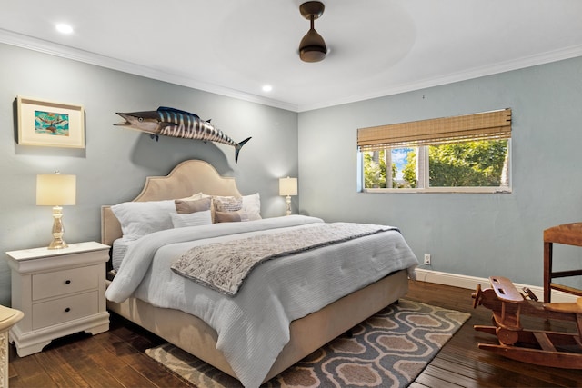 bedroom featuring ceiling fan, dark hardwood / wood-style flooring, and crown molding