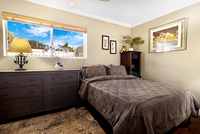 bedroom featuring dark hardwood / wood-style floors and ornamental molding