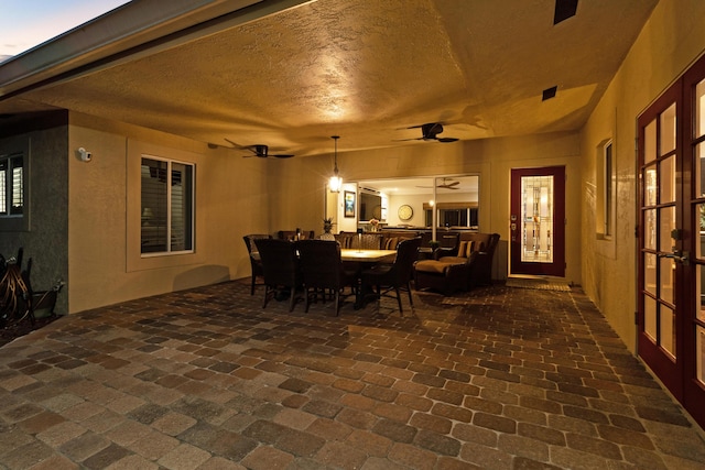 dining area with ceiling fan and french doors