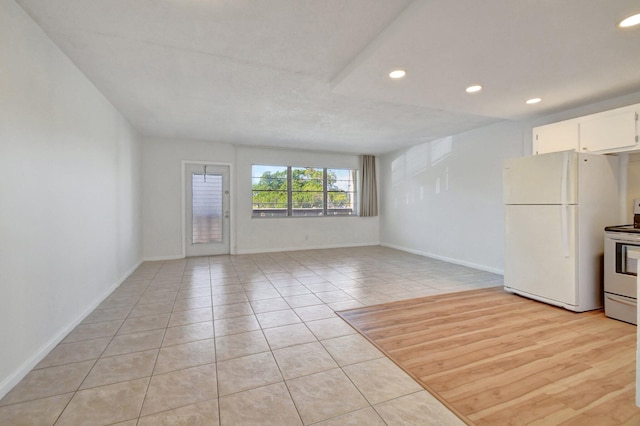 unfurnished living room featuring light hardwood / wood-style floors