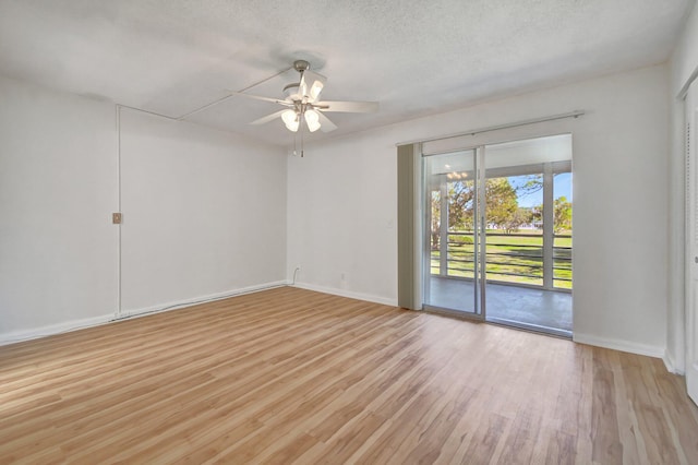 spare room featuring a textured ceiling, light hardwood / wood-style flooring, and ceiling fan