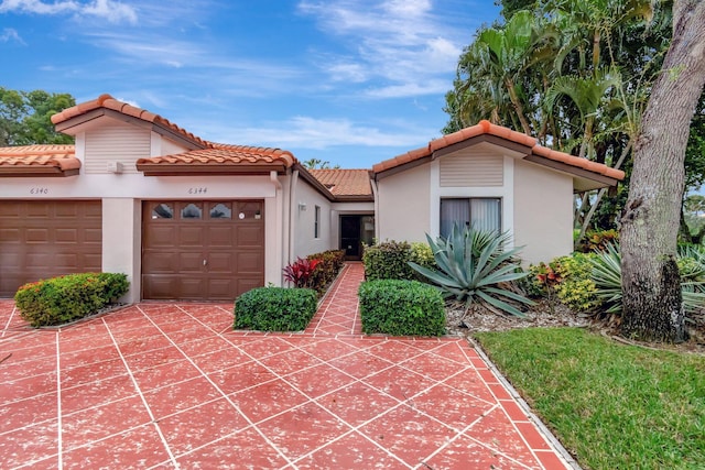 view of front of property with a garage