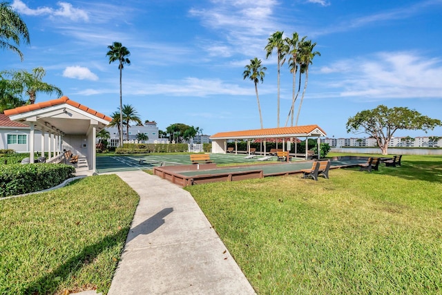 view of home's community with a lawn