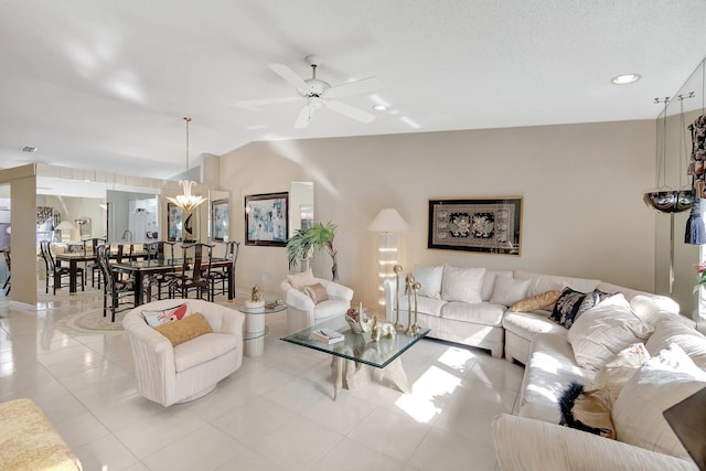 tiled living room with ceiling fan and lofted ceiling