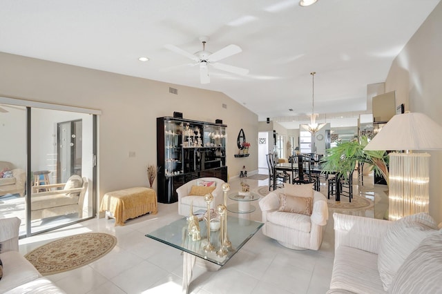 living room with ceiling fan, light tile patterned flooring, and vaulted ceiling