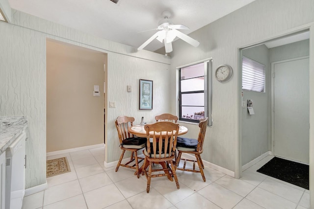 dining room with light tile patterned floors and ceiling fan