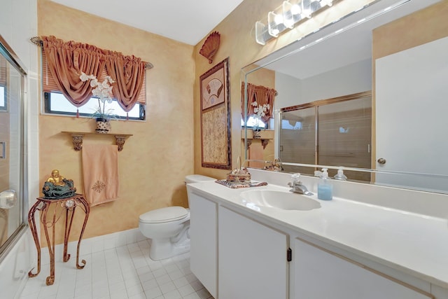 full bathroom with toilet, vanity, tile patterned floors, and shower / bath combination with glass door