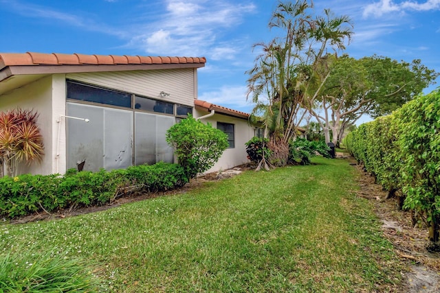 view of yard featuring a sunroom