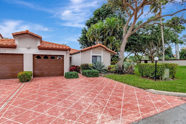 mediterranean / spanish-style home with a garage