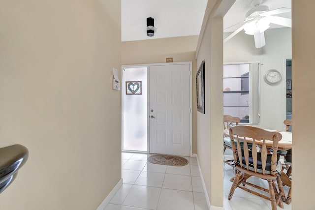 foyer with ceiling fan and light tile patterned floors