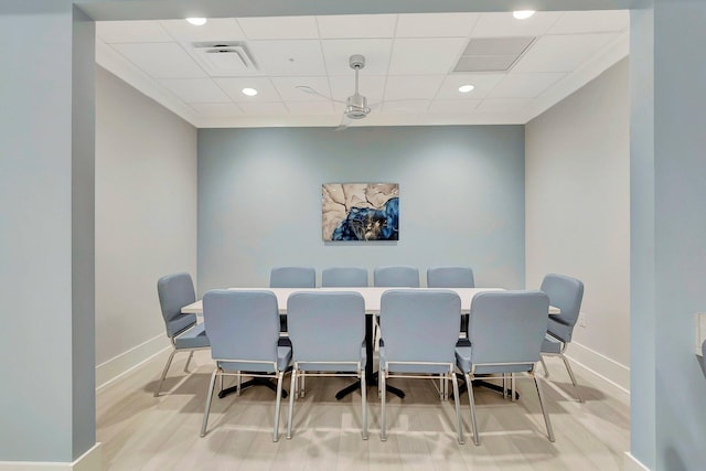 dining room featuring a drop ceiling