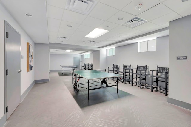 recreation room with a drop ceiling