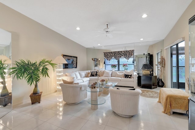 tiled living room with plenty of natural light, ceiling fan, and vaulted ceiling