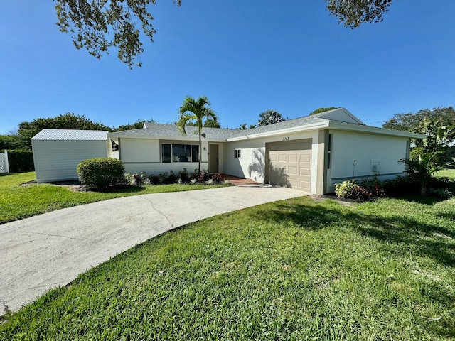 single story home with a garage and a front yard